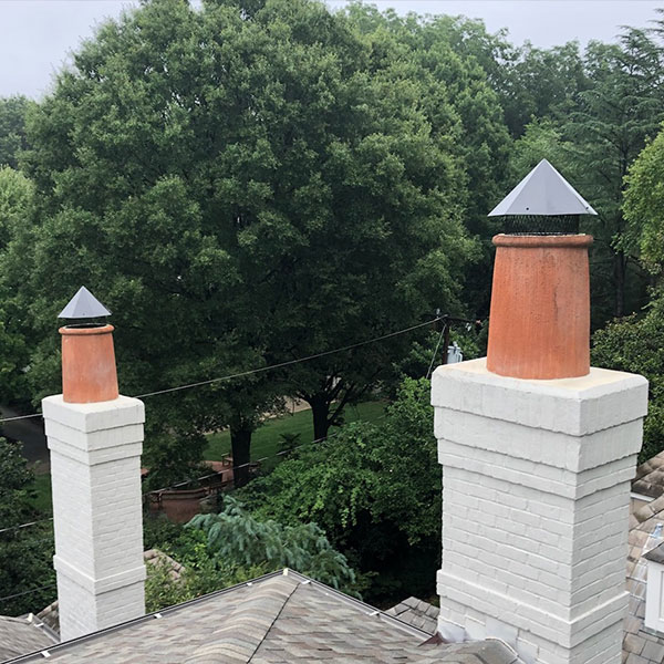 Pot With Octagonal Style Steep, Pitch Lid, Powder Coated Pots are powder coated sitting on top of ceramic flue with white chimney