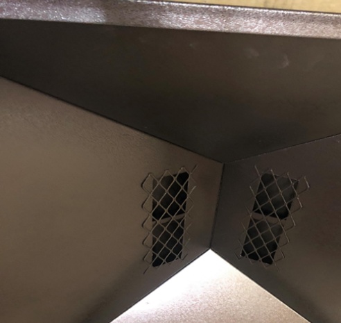 Custom outside mount chimney cap with barrel lid with trees in background